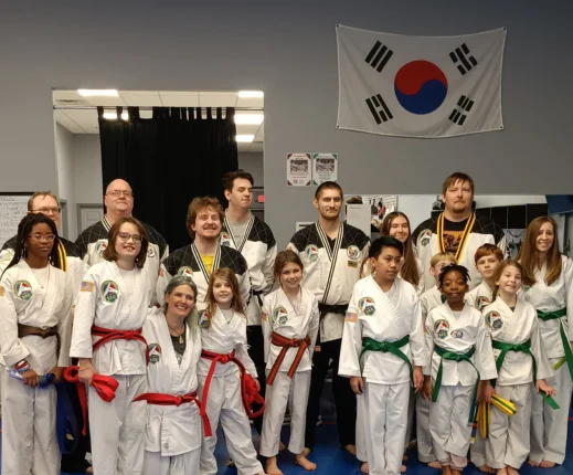 martial arts students taking a group photo